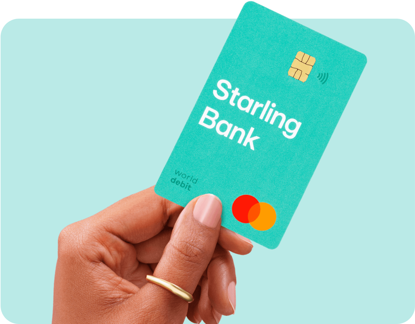 A hand holding a Starling Bank Current Account debit card