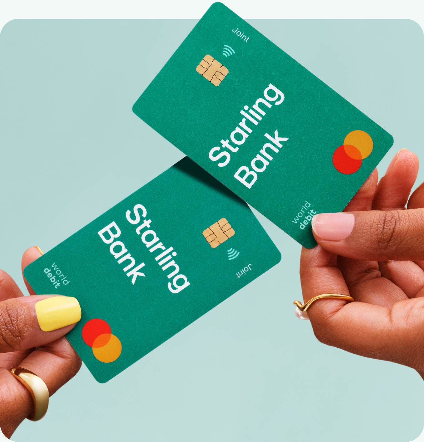 2 green coloured Starling Bank joint account debit cards