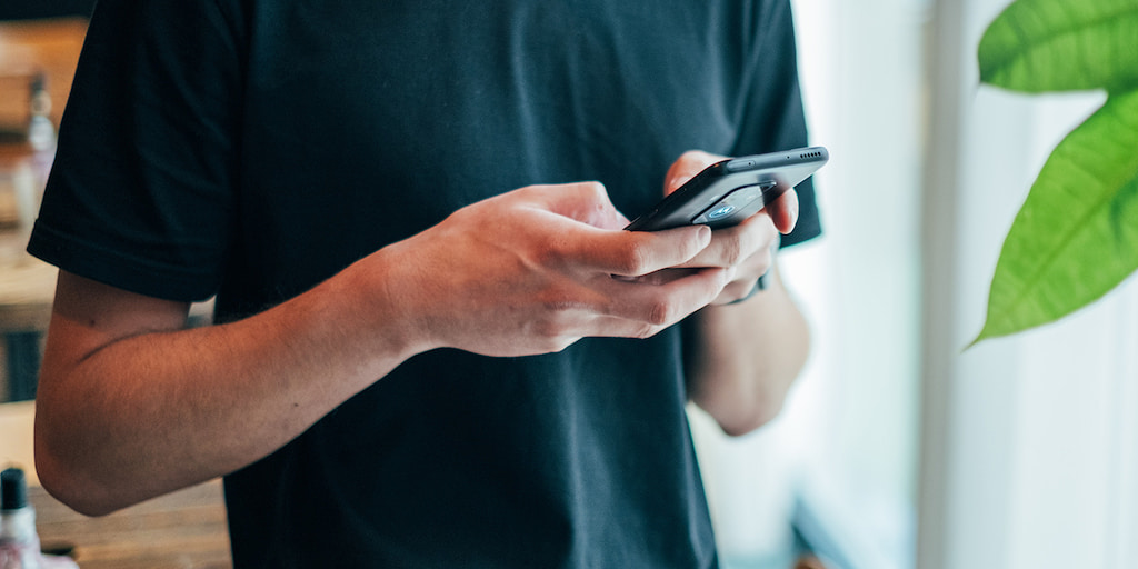 A Man holding phone in hands