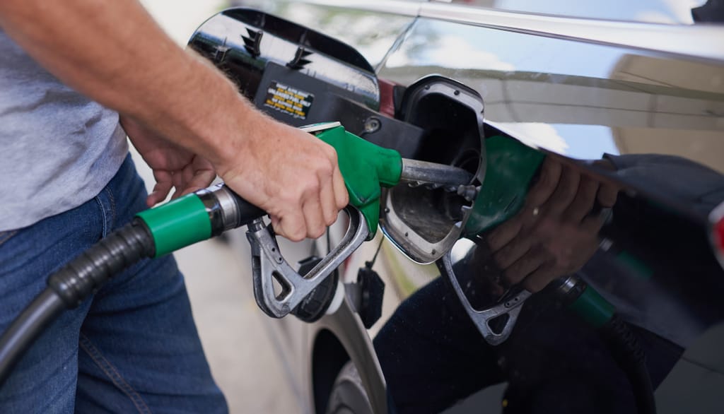 Someone filling up a car with petrol