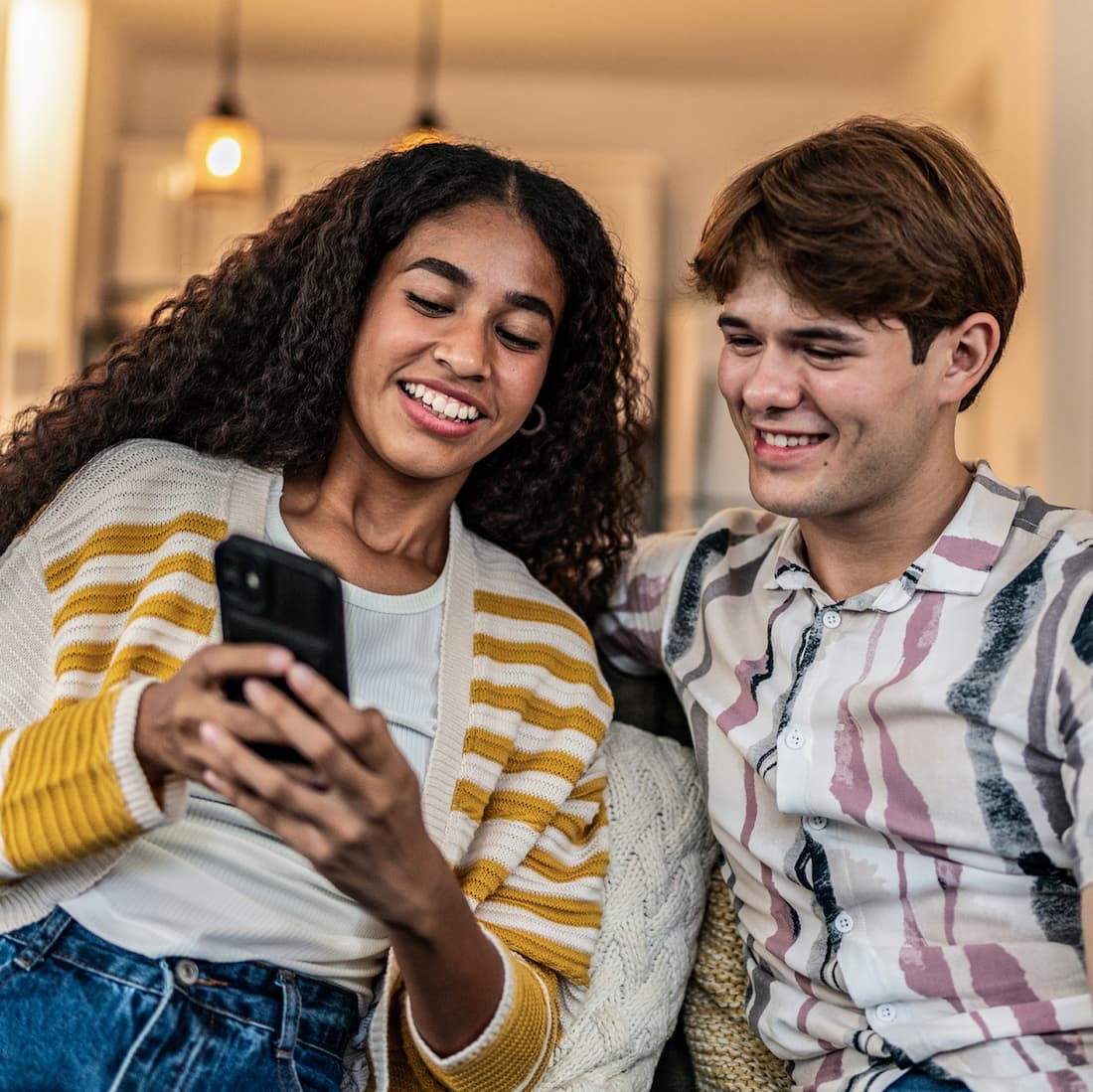 Teenagers looking at smartphone