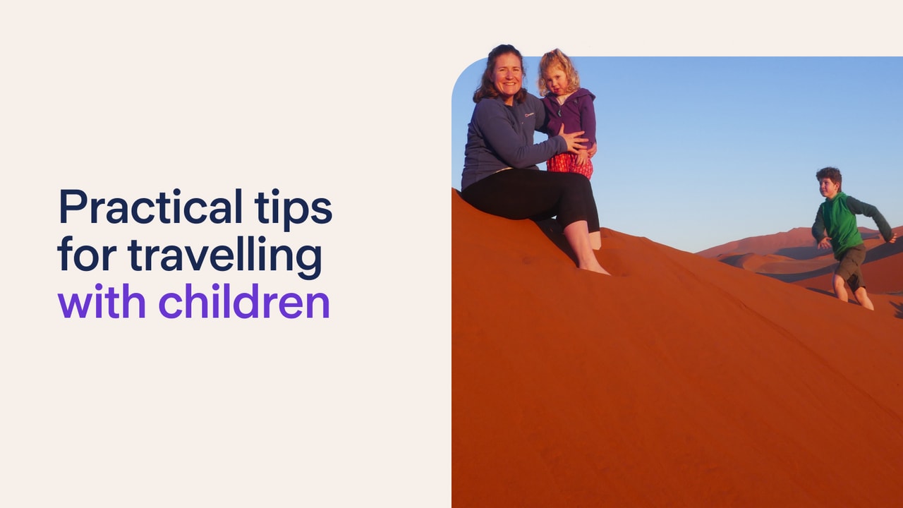Family playing on sand dunes