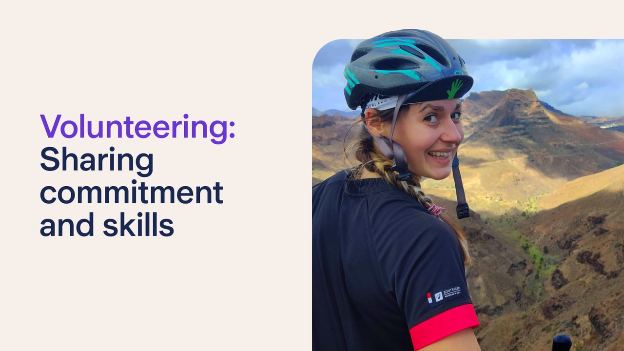 A cyclist, with a mountain in the background