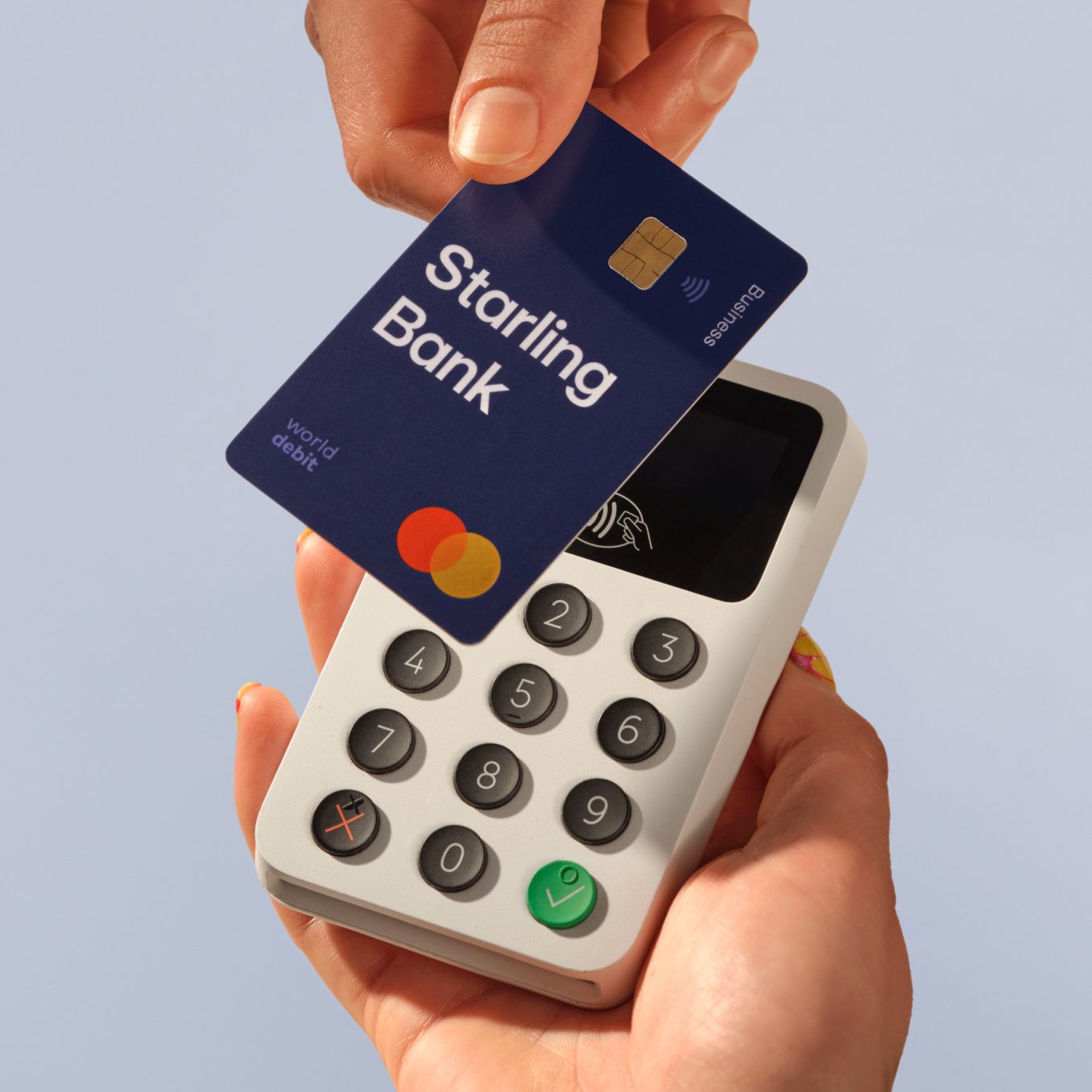 Starling Business debit card being tapped on card reader