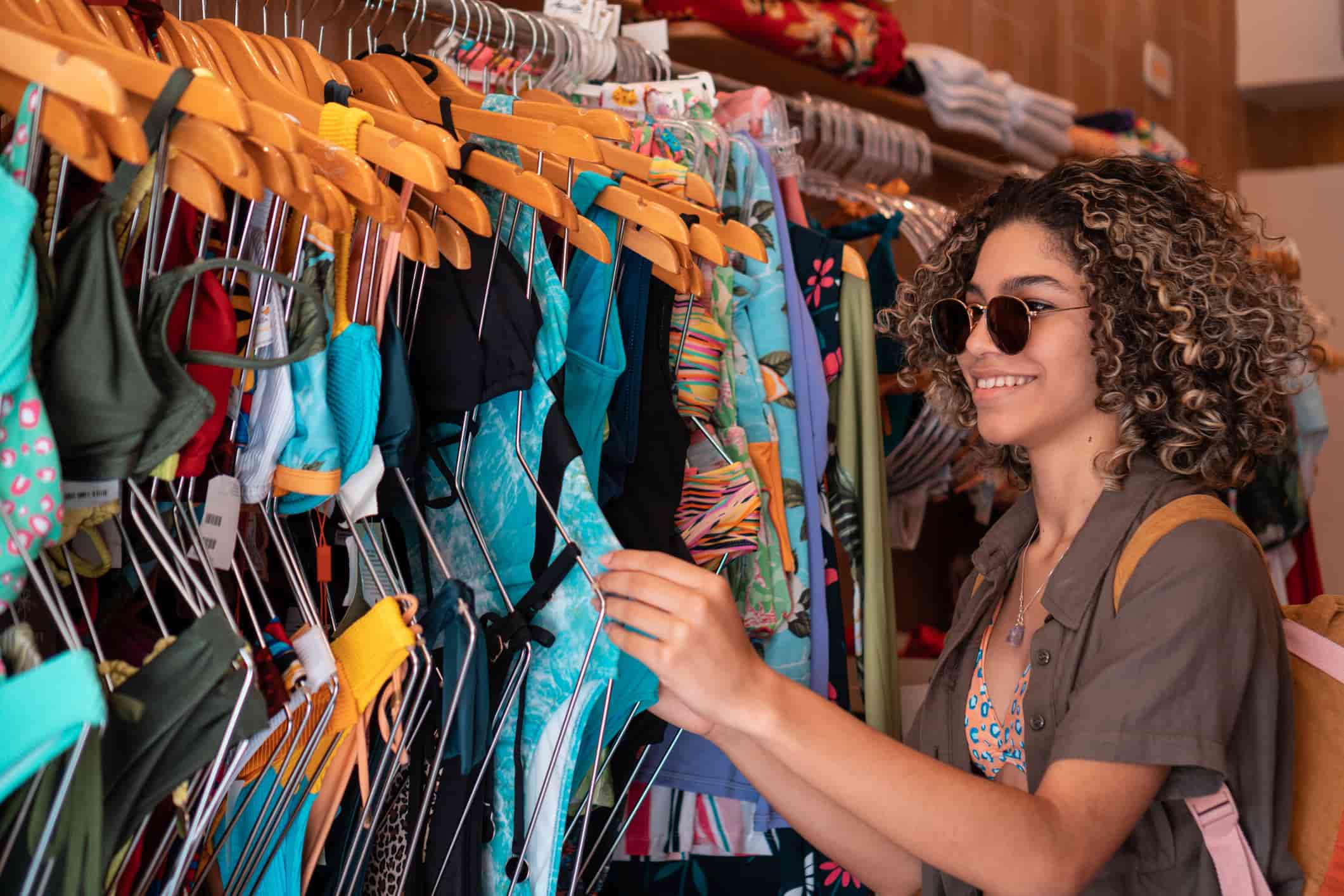 A woman in sunglasses clothes shopping