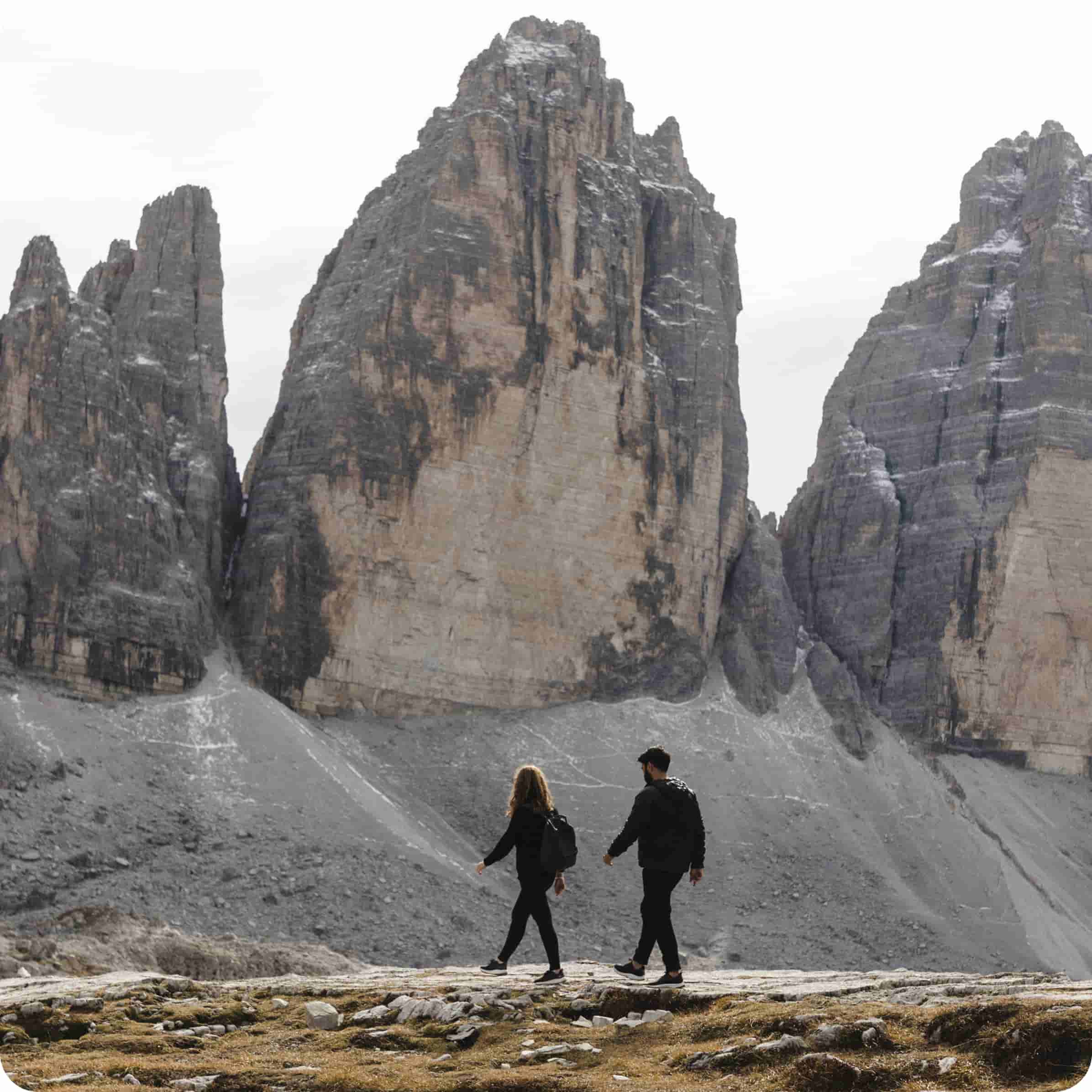 An image showing two people trekking