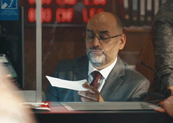 Man looking at cheque