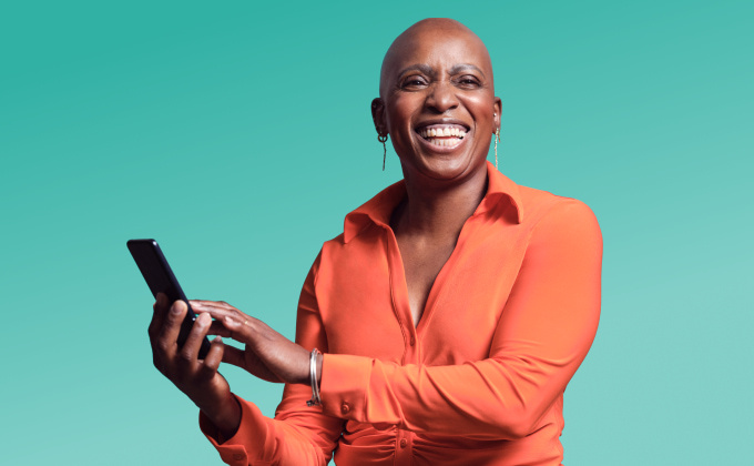 Woman smiling holding phone