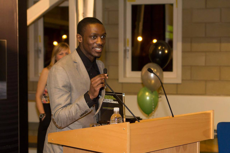 Claud accepts an award for his multi-media company