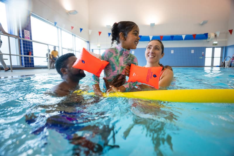 A family having fun in a swimming pool