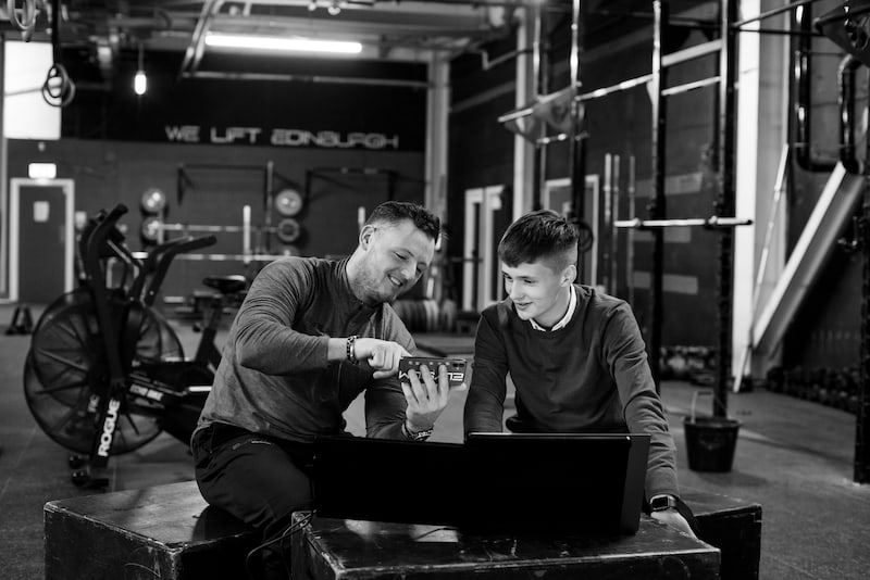 Flynn and his client at a gym