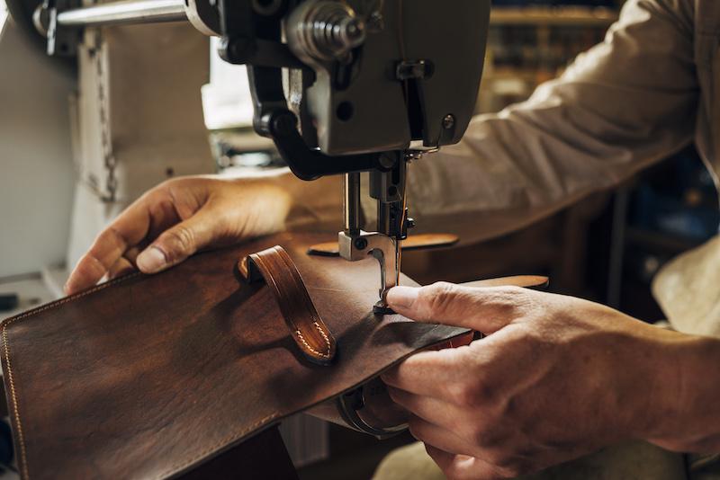 Starling Business customer Jon crafts a leather item.