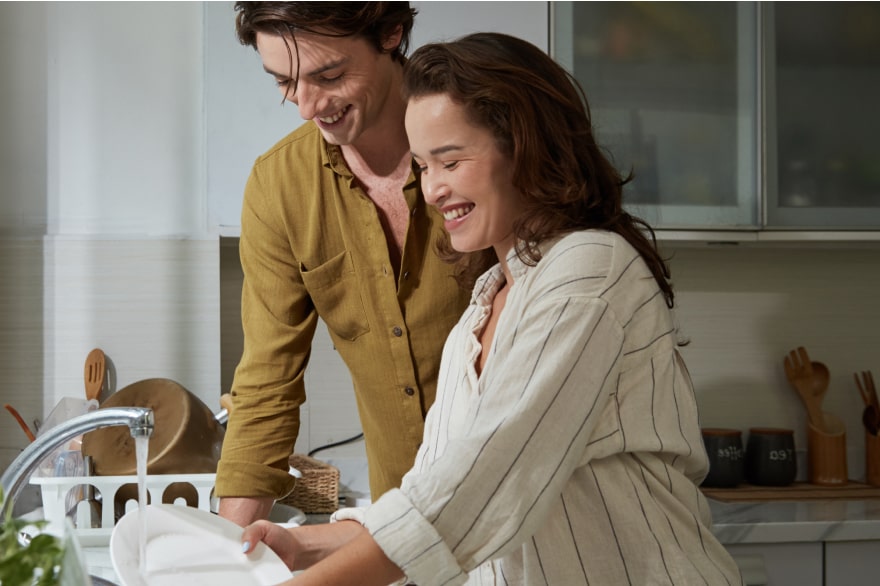 A couple doing the dishes