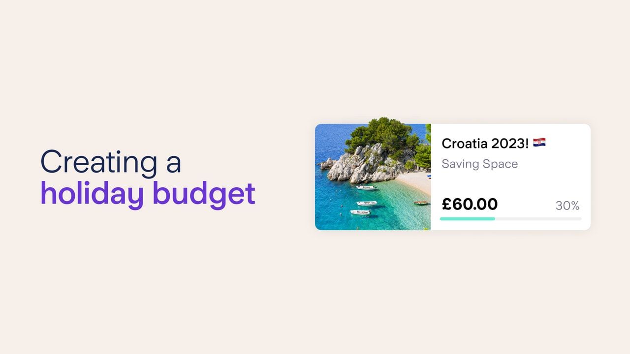 Creating a holiday budget. Starling Bank's saving space feature titled 'Croatia 2023!' with an emoji of the Croatia flag next to the title. The space's picture is of a beach near a cliff with four boats near the shore.