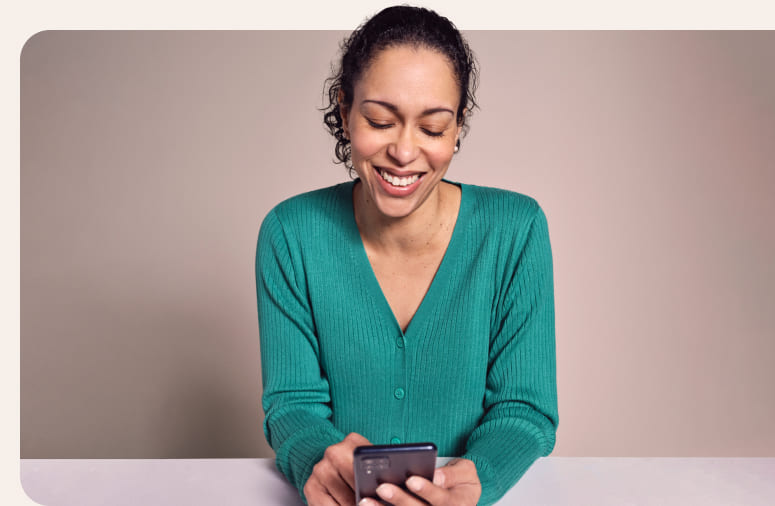 A lady sat using her phone