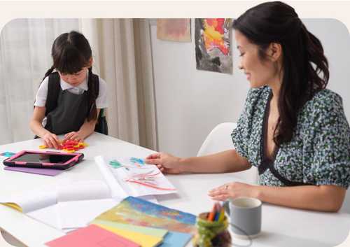 Mother and daughter filling in worksheet